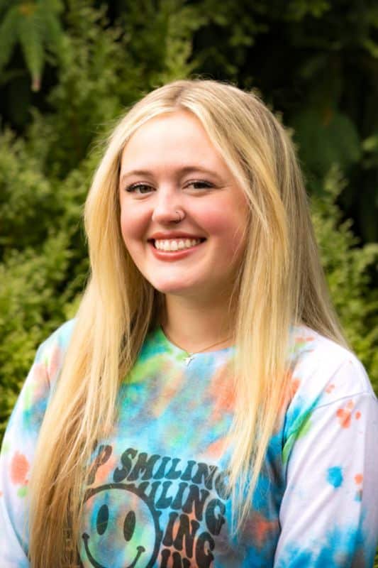 a woman smiling at camera