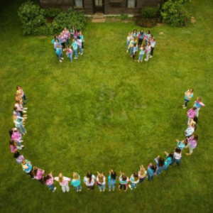 Aerial view overlooking people formed to make a smiley face, representing Puget Sound Pediatric Dentistry