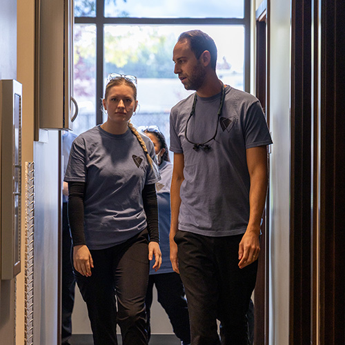 Team walking through office discussing course of action for current patients